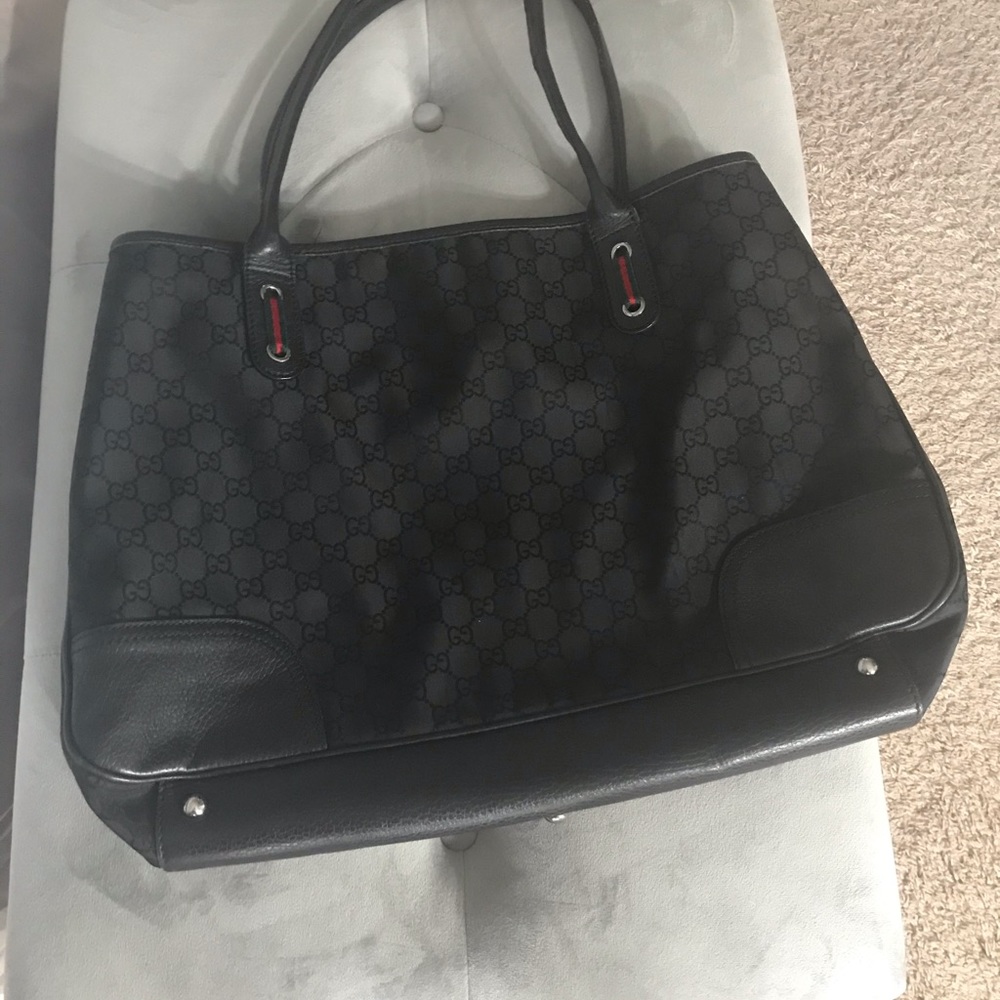 Authentic Gucci black leather and gold bag